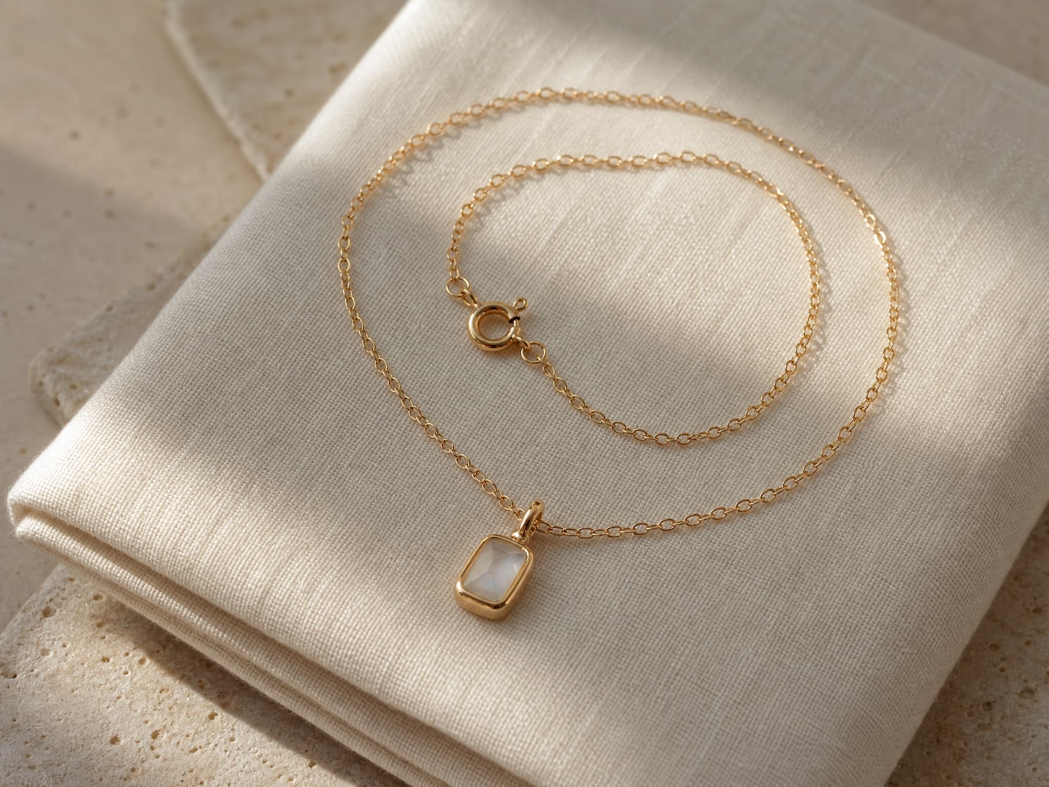 Necklace flat lay on linen